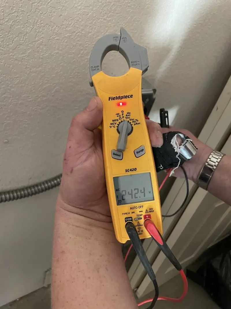 Voltage testing with clamp meter during Ceiling Fan Installation in Carterville